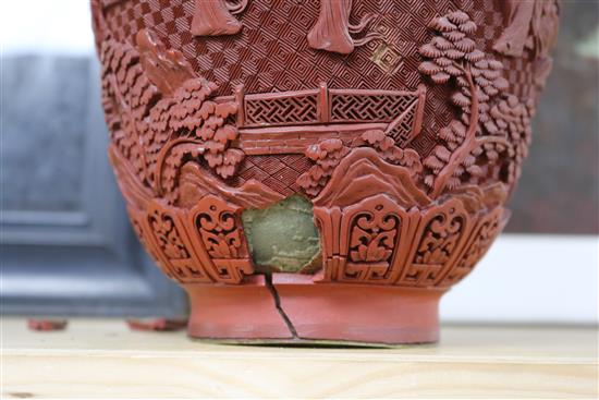 A Chinese cinnabar lacquer vase, late 19th century, enamel interior 33cm